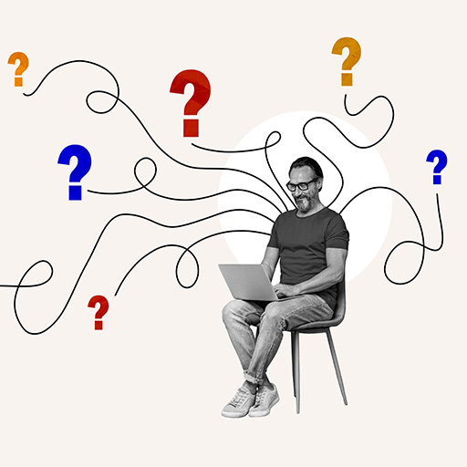 Man sitting with a laptop surrounded by colorful question marks, representing quiz design and attributes.